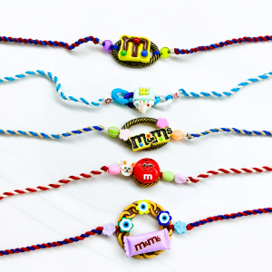 Unique M & M theme rakhi design set.