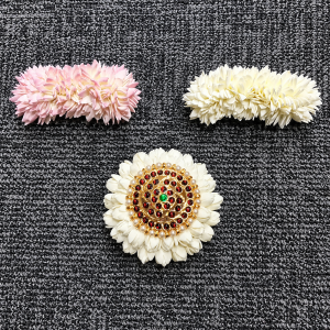 Artificial flower hair clips displayed together.