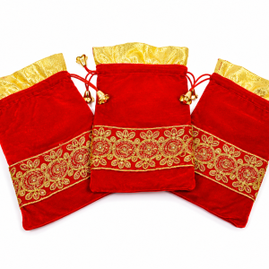 Embroidered red velvet potli bags.