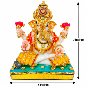 Handcrafted Lord Ganesha idol featuring vibrant orange and yellow attire adorned with sparkling jewel work atop a turquoise base.