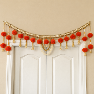 An orange and white pearl-beaded decorative door hanging featuring marigold-style flowers and hanging tassels.