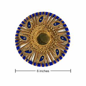 A decorative tealight / candle holder in blue color, used for Deepavali and festive decors.